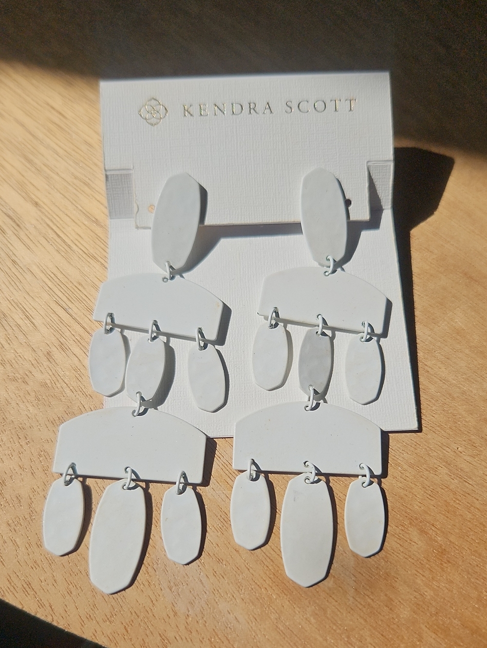 Kendra Scott white dangle earrings